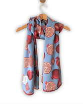 Pomella Sky — A refined fusion of cool sky-blue tones and the richness of ripe pomegranates.
